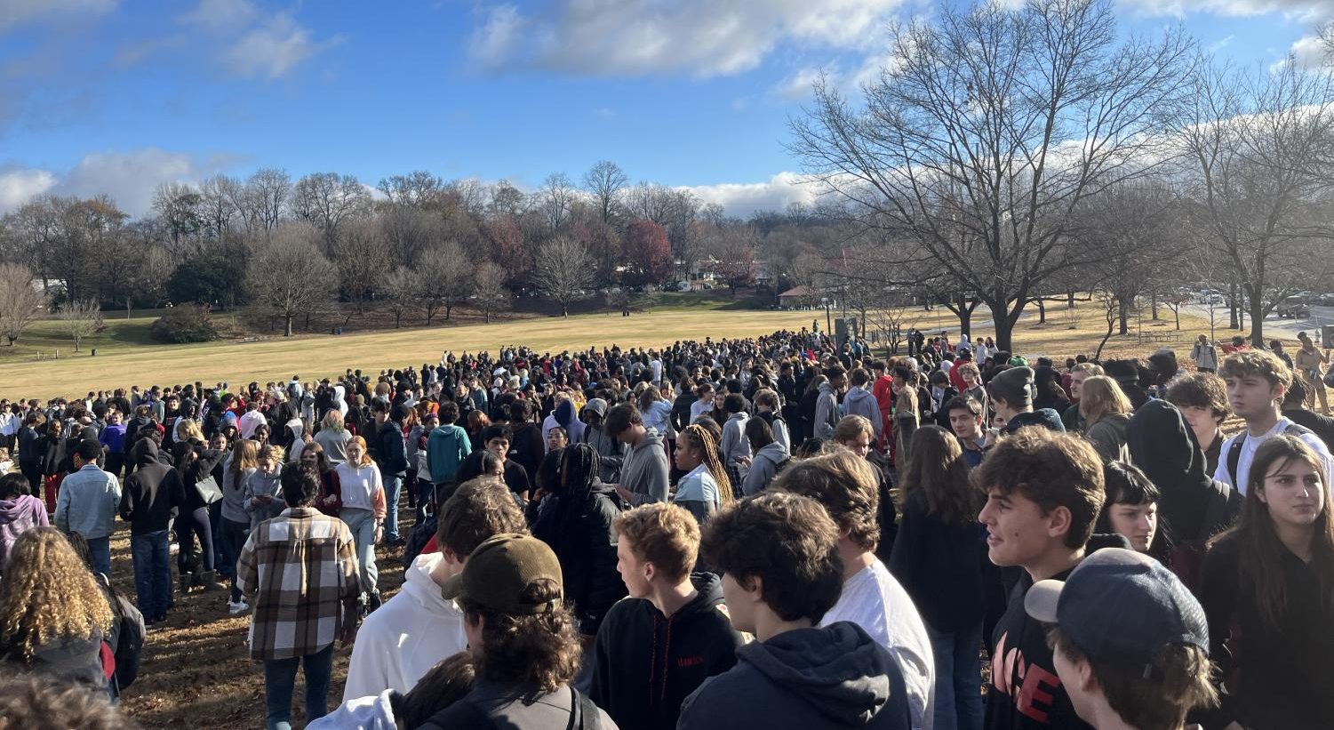 An image of students gathered outside after receiving bomb threat